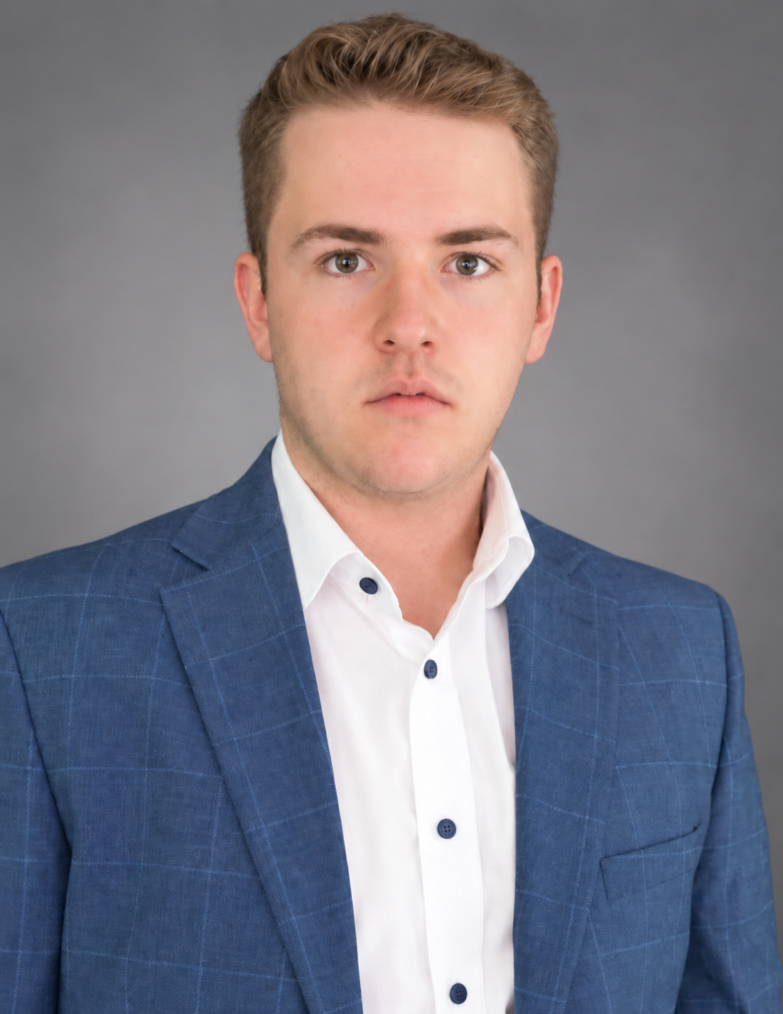 Connor Valenti in a blue blazer and white shirt